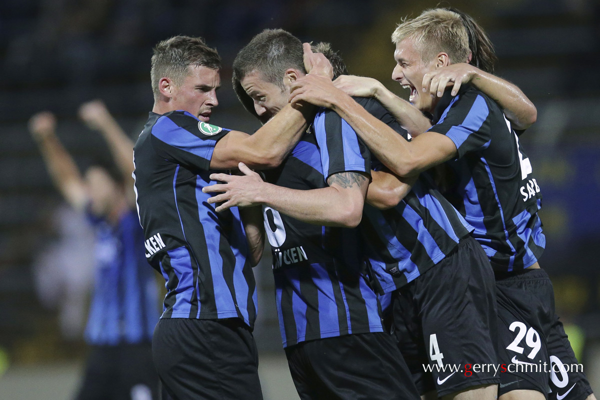 Players of FC Saarbreücken (Germany) celebrating the goal of 2-2  equalization against Kickers Offenbach