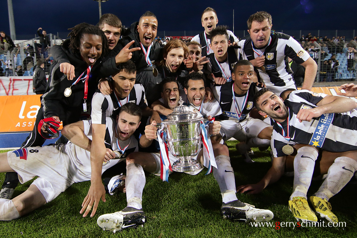 Players of Jeunesse Esch celebrate the win of the Cup in Luxembourg