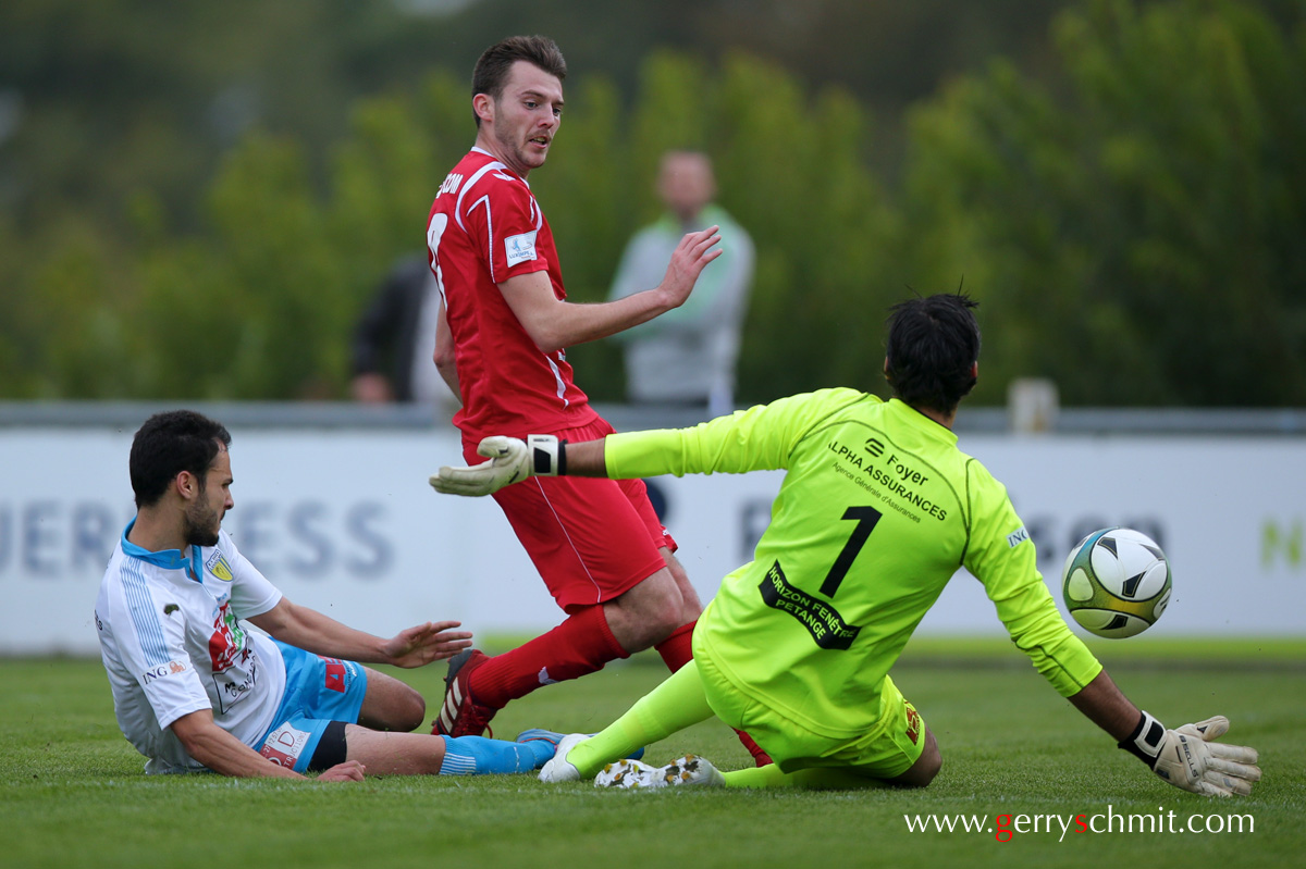 Antonio Casafina (Swift) tries to score against Titus Lamadelaine 