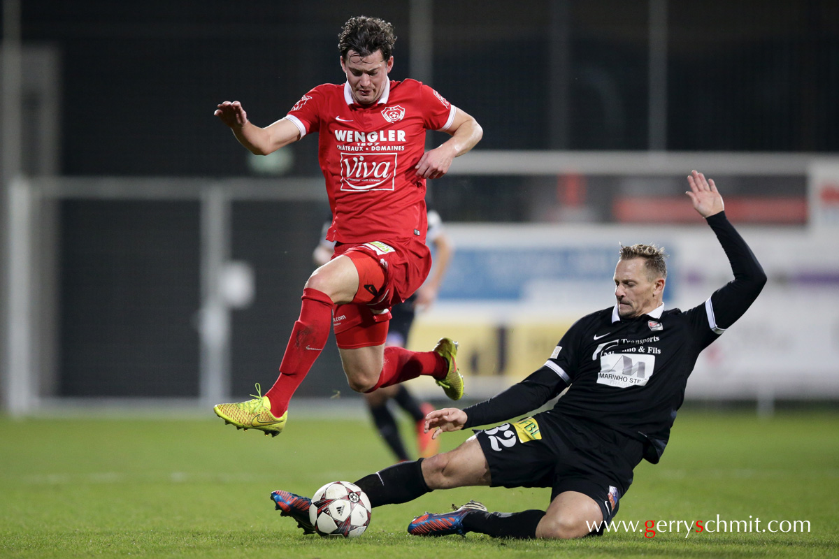 Jean-Philippe Caillet (D03) tackles against Christian Adams (Rosport) during BGL Ligue game