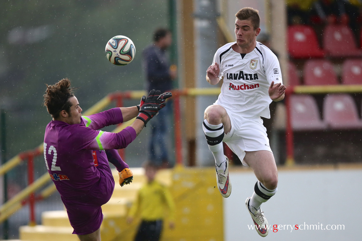 Dave Turpel (F91) tries to score against Leo Clement (Etzella)