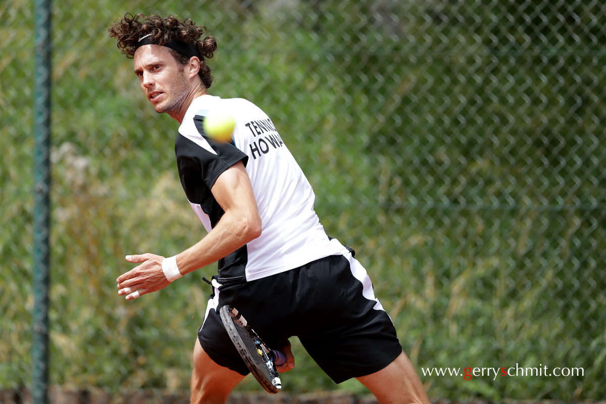 Gilles Kremer goes for an artistic shot in tennis