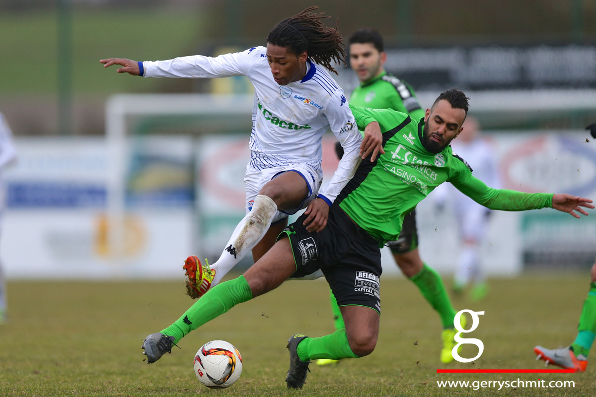 Ahmed Benhemine (US Mondorf) challenges Gerson Leal (RFCUL) during BGL Ligue game