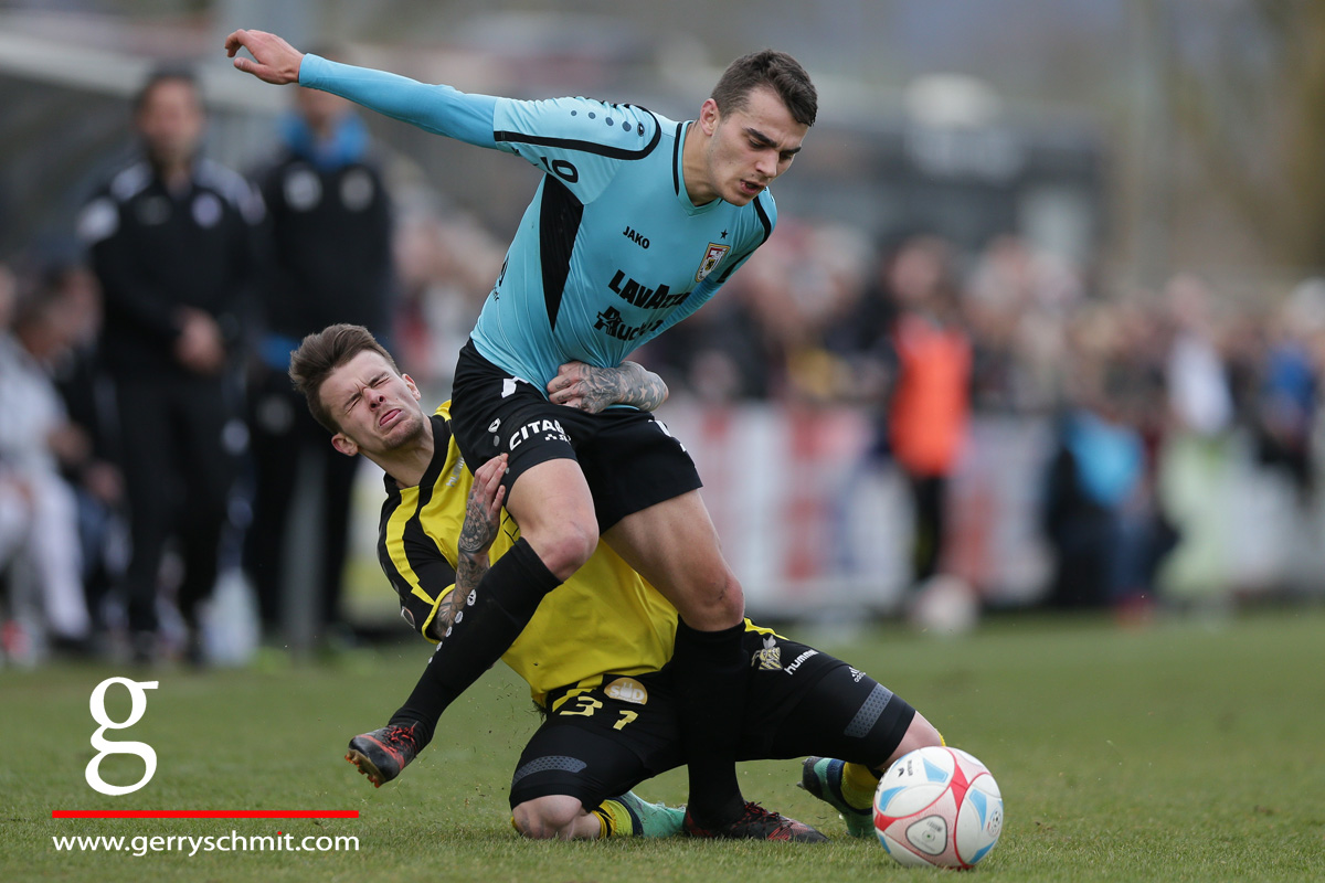 Sebastien Thill (Progres Niederkorn) tries to stop Danel Sinani of F91 Dudelange