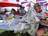 Andre GREIPEL reads the Newspaper before the start of stage number 20 at Annecy