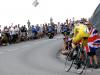 Chris Froome is pushed by a fan during time trials at Chorges