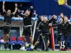 Michael O'Donnell celebrates the 2-0 lead of Northern Ireland against Ukraine with his staff