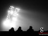 Spectator watch a floodlight football game